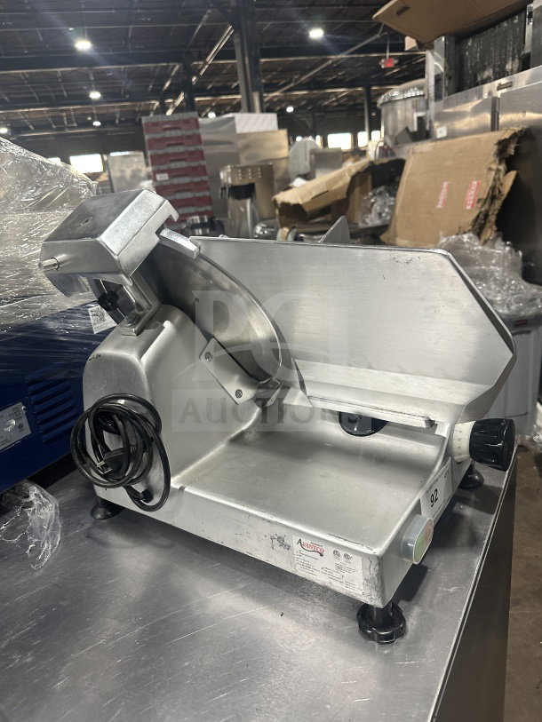 Avantco Commercial Stainless Steel Countertop 12" Semi-Automatic Deli Slicer, Model 300ES12. Features on legs, 110/120V, with visible control knobs and power cord; used condition.