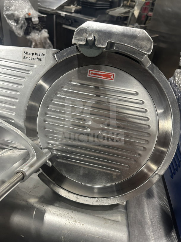 Avantco 300ES12 stainless steel deli slicer, semi-automatic, 12" blade, sharpness warning label, 110/120V, countertop model.