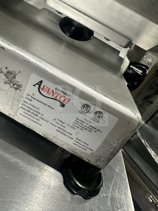 Avantco 300ES12 stainless steel deli slicer. Semi-automatic, 12" blade, 110/120V, on legs. Used condition, label shown.