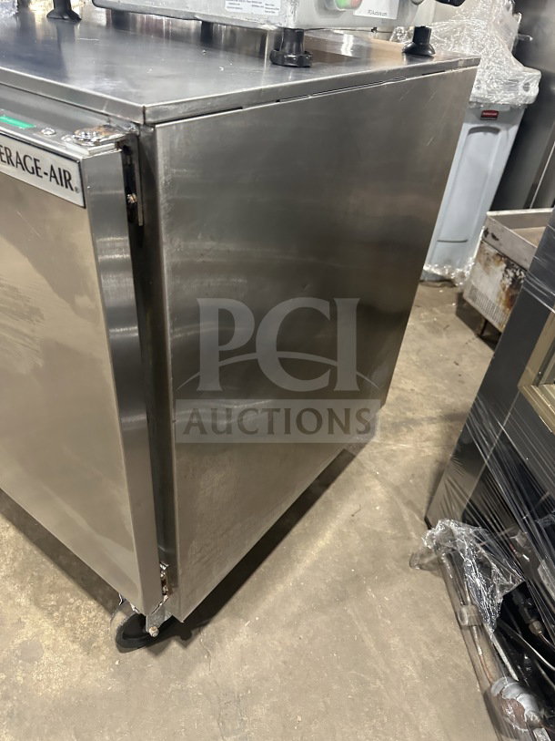 Beverage-Air stainless steel 3-door undercounter refrigerator, model UCR72AHC, on casters, with poly-coated wired rack.