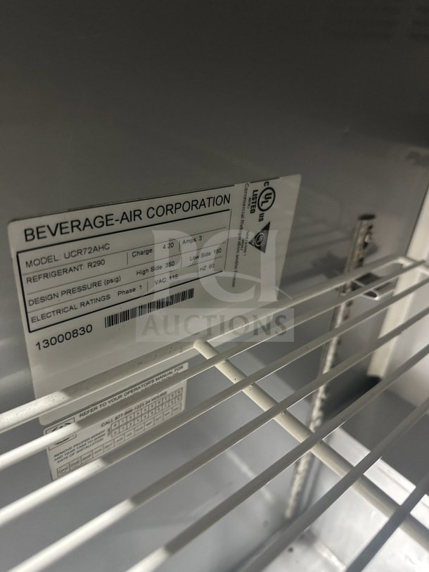 Beverage-Air UCR72AHC commercial stainless steel 3-door undercounter refrigerator, poly coated wired rack, model and serial labels visible.