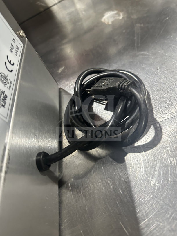 Carnival King stainless steel waffle maker, model 382WBM13DGT, with 120V power cord. Features non-stick grid and audible timers.
