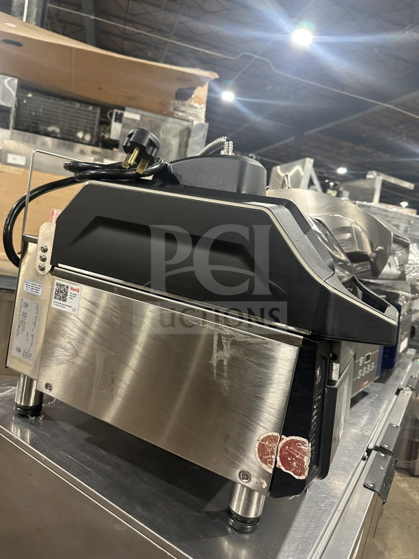 Electrolux stainless steel electric infrared flat press, model HSPP2RPRS, with digital controls and visible markings, in good condition.
