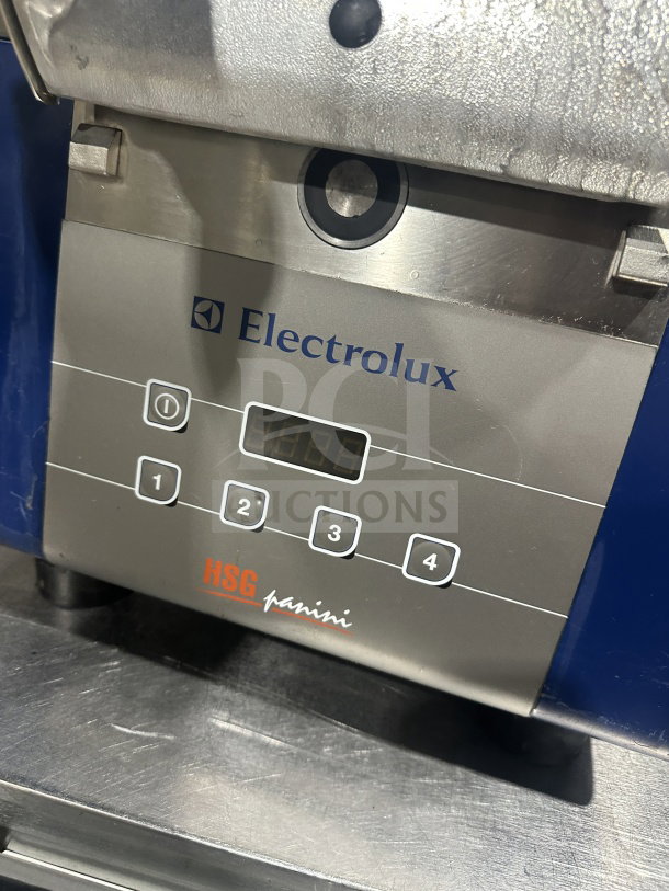 Electrolux HSPPA1 stainless steel high-speed panini press, 2016 model, commercial-grade, electric, 208V, on legs.