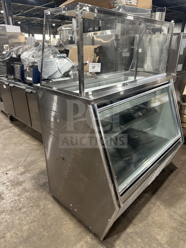 Leader stainless steel refrigerated deli case with sliding rear glass doors and ambient top counter display. Used condition.