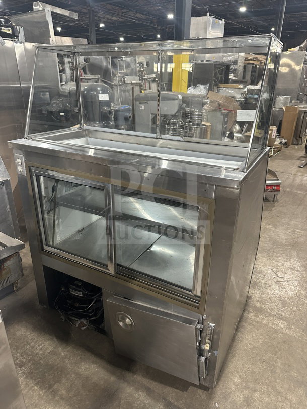 Leader commercial stainless steel refrigerated deli case with dual sliding glass doors, ambient top counter, used condition.