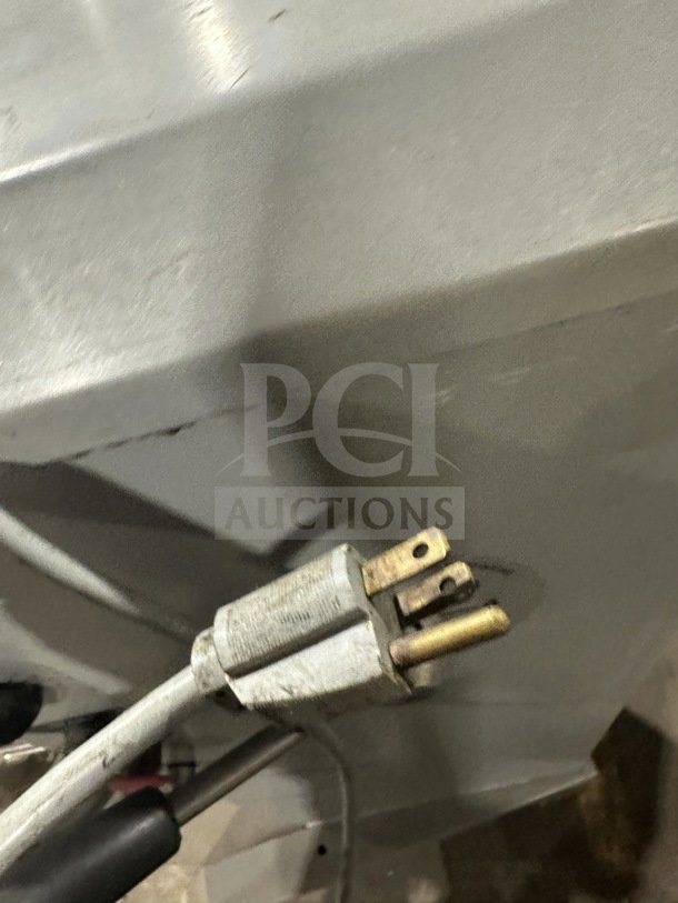 Univex SRM30+ 30 Qt commercial planetary mixer plug detail, stainless body, and electrical cord, on legs.