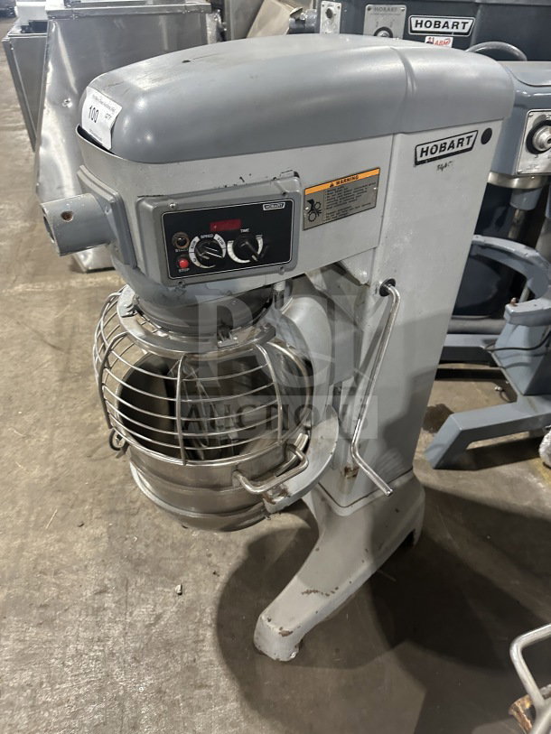 Hobart HL300 30 Qt. planetary mixer with stainless steel bowl guard and mixing bowl, flat beater attachment, model serial tags.