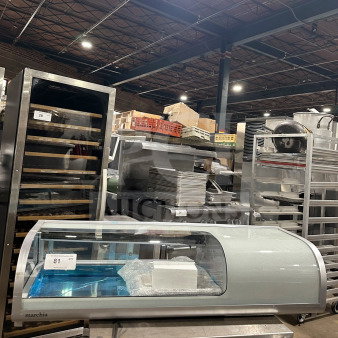 Marchia MSU140S stainless steel 46" sushi merchandiser with curved glass, LED lights, double sliding doors, and 4 pans. New condition.