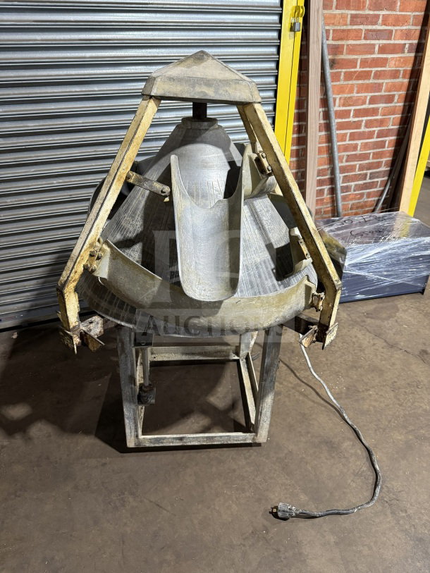 Commercial stainless steel conical dough rounder machine in fair condition, electric-powered with visible wear.