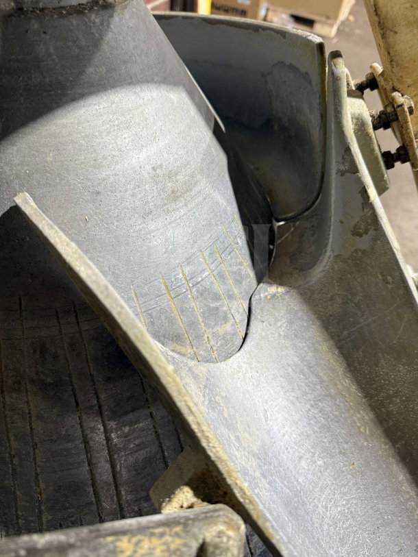 Commercial stainless steel conical dough rounder machine, electric-powered, used condition, showing interior details.