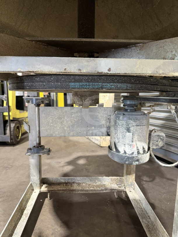 Commercial stainless steel electric conical dough rounder machine, showing motor and belt system, in used condition.
