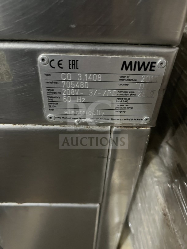 Miwe stainless steel electric oven, model CO31408, serial 702515, 208V, on casters, steam injected, tag visible.