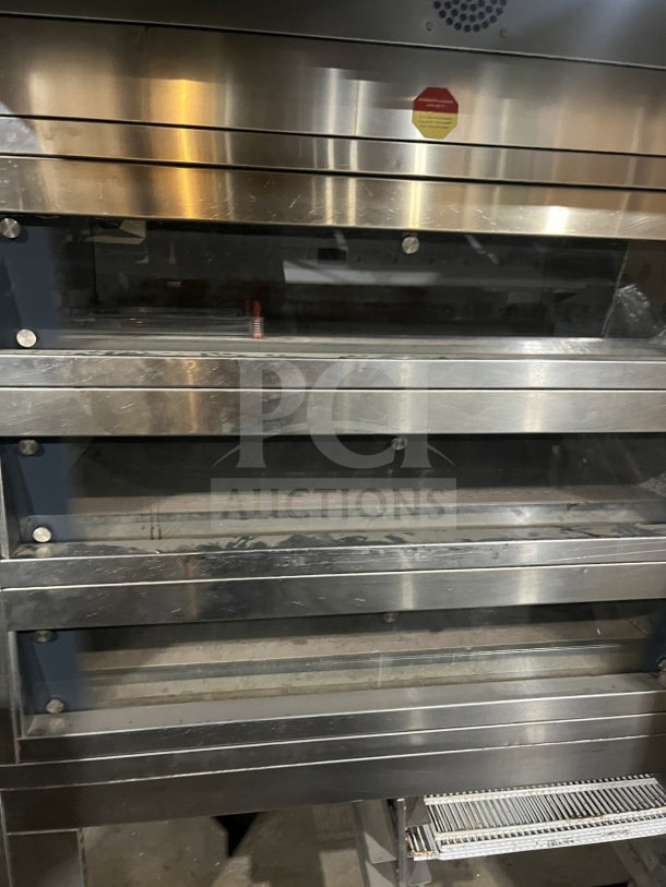 Empire Miwe stainless steel triple deck oven, model CO31408, steam injected, on casters, 208V, visible wear, SN: 702515.