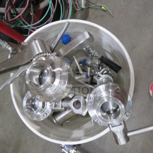 Alt text: Stainless steel components of a One 3 Vessel Brew House with a heat exchanger, 253-gallon capacity, in good condition.