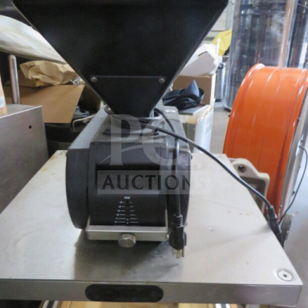 Brewtech SS 304 grain mill on casters, features metal construction, adjustable settings, plug-in cable, industrial condition.