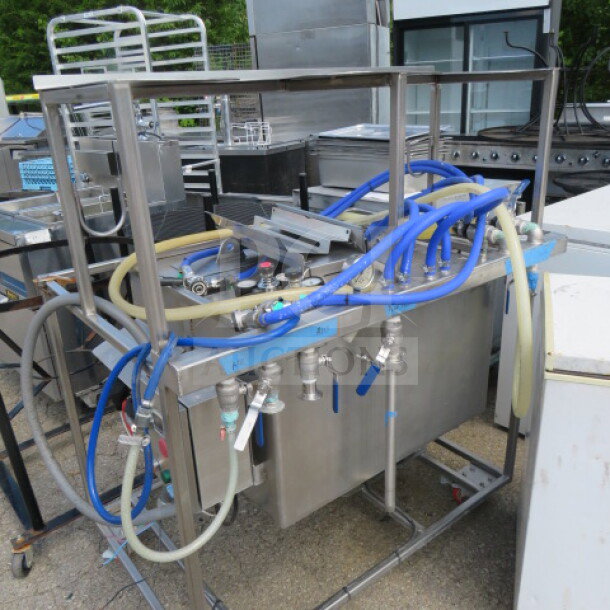 One 3 Vessel Brew House with Thermaline Heat Exchanger, 253 Gallons. Features stainless steel construction and fitted hoses.