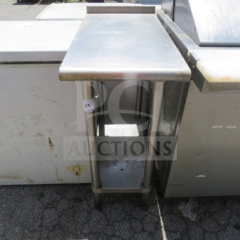 Stainless steel table with under shelf, dimensions 15x30x37 inches. Visible wear, suitable for commercial use.