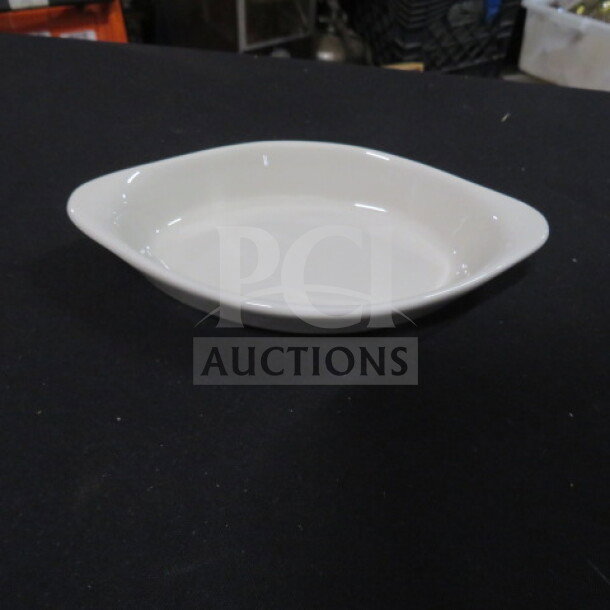 White 6.5x3.5 inch Welsh Rarebit dish, new condition, oval shape, smooth finish.