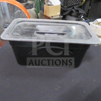 1/3 size, 6-inch deep black food storage container with clear lid. Used condition, secure fit for efficient storage.