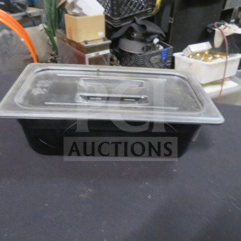 1/3 size, 4-inch deep black food storage container with lid. Used condition. Ideal for kitchen organization. Model: 2XBID.