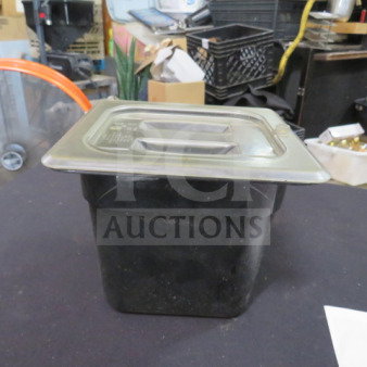 1/6 size food storage container, black, 6-inch deep with lid, used condition. Durable for kitchen or pantry use.