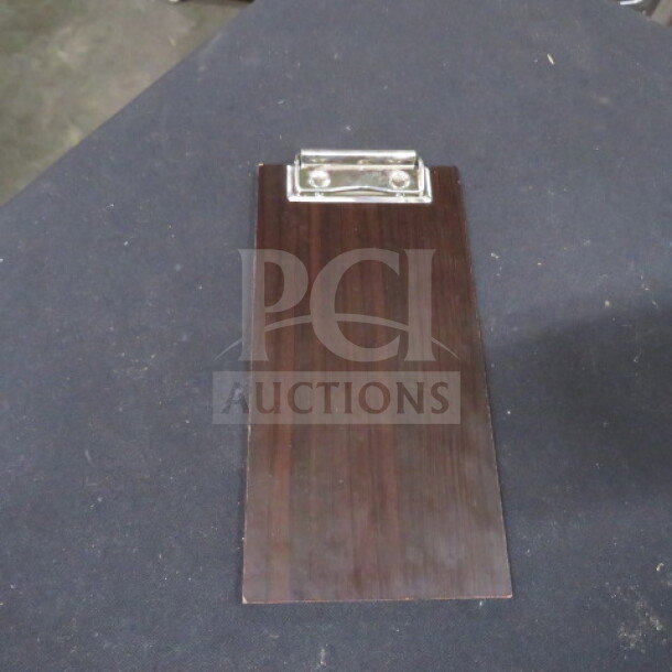 One of 12 check presenters, dark wood finish, features metal clip. Ideal for restaurants, good condition.