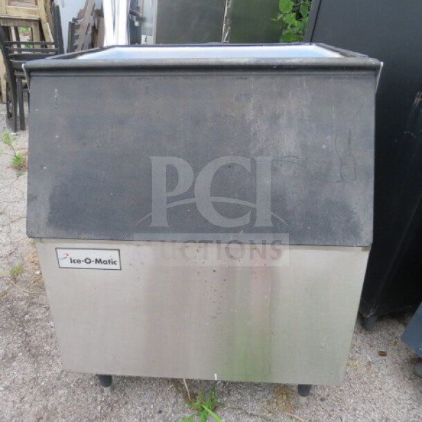 Ice-O-Matic ice bin, 30.5x32x37 inches, stainless steel, used condition, visible brand label on the front.
