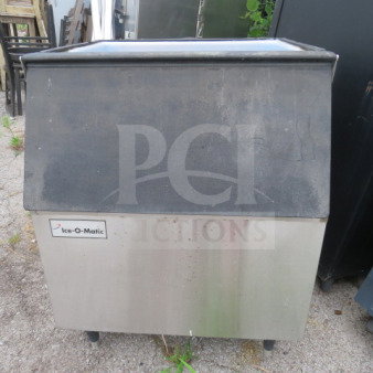 Ice-O-Matic ice bin, 30.5x32x37 inches, stainless steel, used condition, visible brand label on the front.