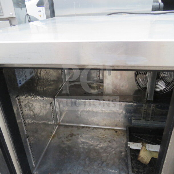 Everest ETBF2 worktop freezer, 2-door, stainless steel, on casters, 47.5x31.5x35 inches, 115V, good condition.