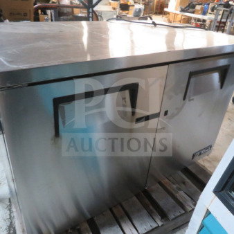 True TUC-48F worktop freezer, stainless steel, two doors, on casters. Dimensions 48x30x34 inches, excellent condition. 115V.