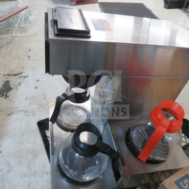 Bunn VP17-3-3L SST coffee brewer with three pots and filter basket, stainless steel, 120V, 16x18x18 inches, used.
