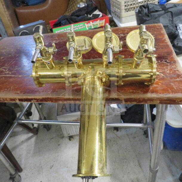 Gold keg tower with 4 taps, polished finish, excellent condition. Ideal for bar setups or home brewing systems.