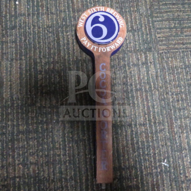 West Sixth Brewing tap handle, Cocoa Porter, wooden with blue and white logo, "Pay It Forward" text, good condition.