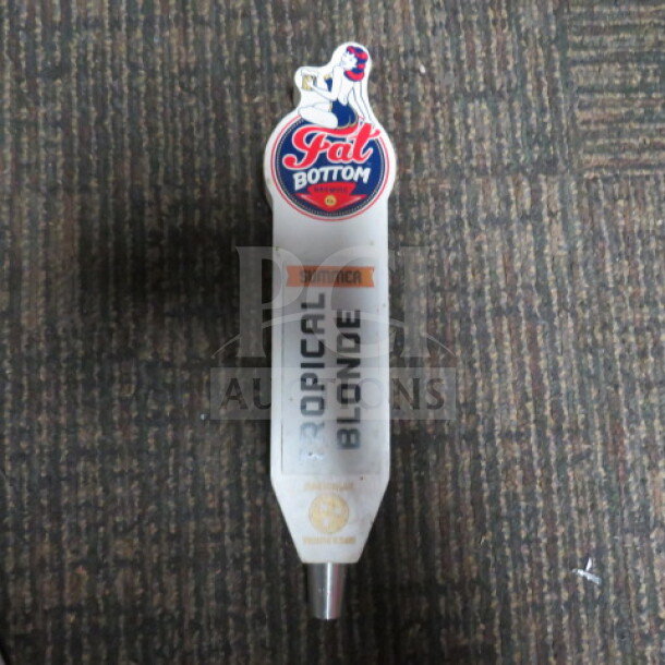 Fat Bottom Tropical Blonde tap handle, good condition, featuring red and blue logo with a pin-up girl illustration.