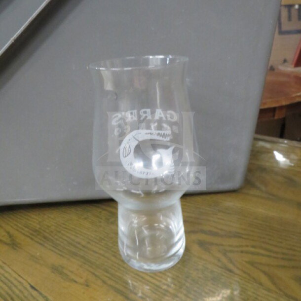Transparent beer glass with "Carpe Diem" etched on the front, in new condition. Flared top with sturdy base.