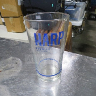 Harp Premium Lager beer glass, clear with blue logo, excellent condition, standard pint size, no visible damage.
