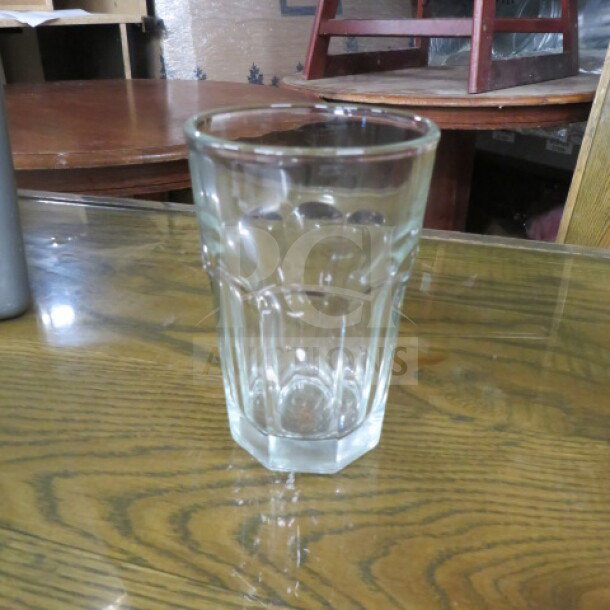 New 10oz bar glass with faceted design, clear glass, model 12XBID. Excellent condition, ideal for beverages.