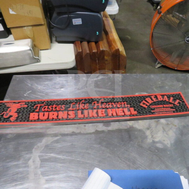 Fireball Bar Mat, black with red text "Tastes Like Heaven, Burns Like Hell," in good condition, ideal for collectors.