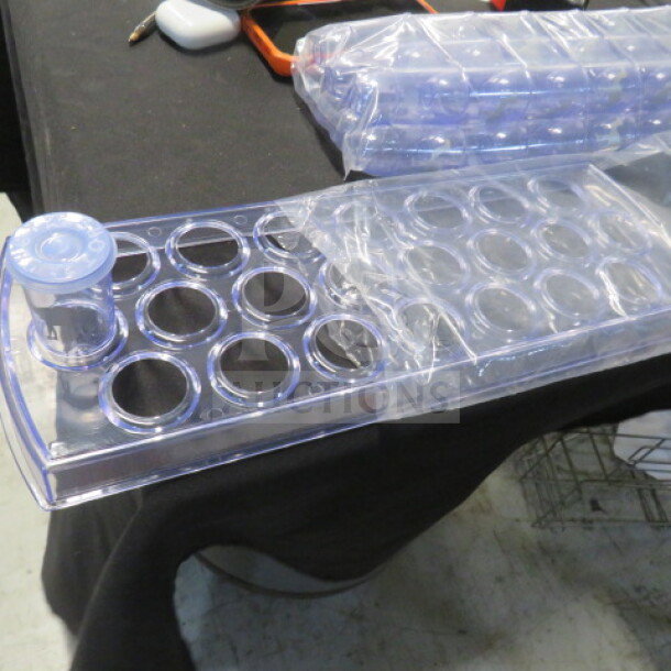 New Horeca shot glass holder with 50 poly shots and lids; clear plastic, unused condition, ideal for party events.
