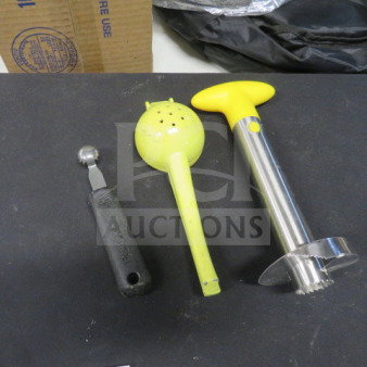 Assorted bar tools set including melon baller, citrus squeezer, and stainless steel corer. Good condition.