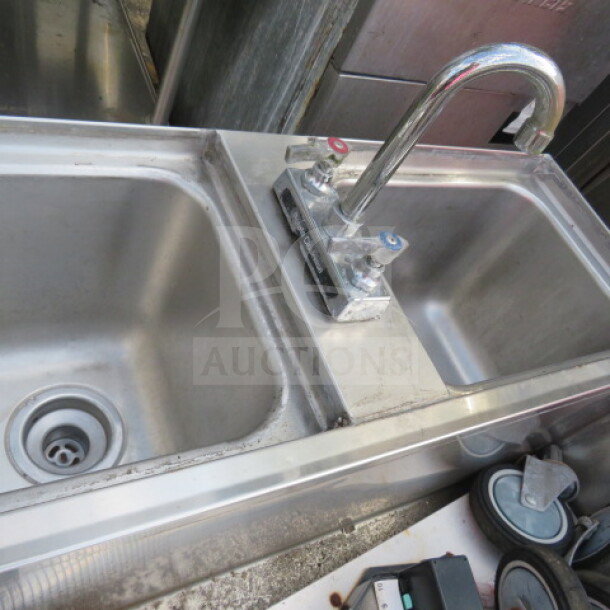 LaCrosse dual sink with ice well and faucet, equipped with two Wunderbar guns. Stainless steel, used condition.