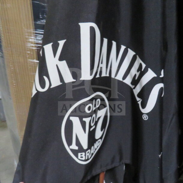 Jack Daniels patio umbrella with "Old No. 7 Brand" logo, black fabric. Great condition, perfect for outdoor use.