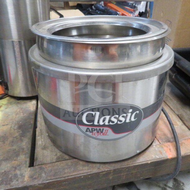 Classic APW Wyott Warmer, Model RW-2V, 120 Volt, stainless steel, round design, excellent condition with visible logo.