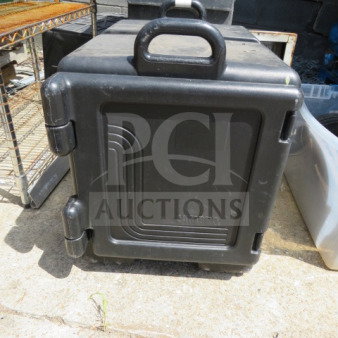 Cambro Ultra Pan food transport container, black plastic, sturdy with ergonomic handles, visible Cambro branding, used condition.