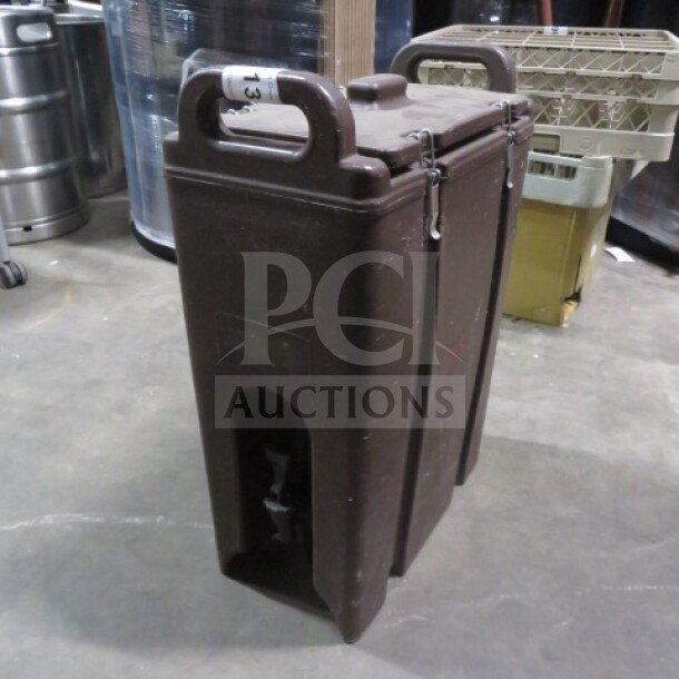 Cambro 500LCD portable beverage dispenser in brown, used condition, with sturdy handles and secure latches.