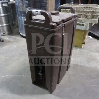 Cambro 500LCD portable beverage dispenser in brown, used condition, with sturdy handles and secure latches.