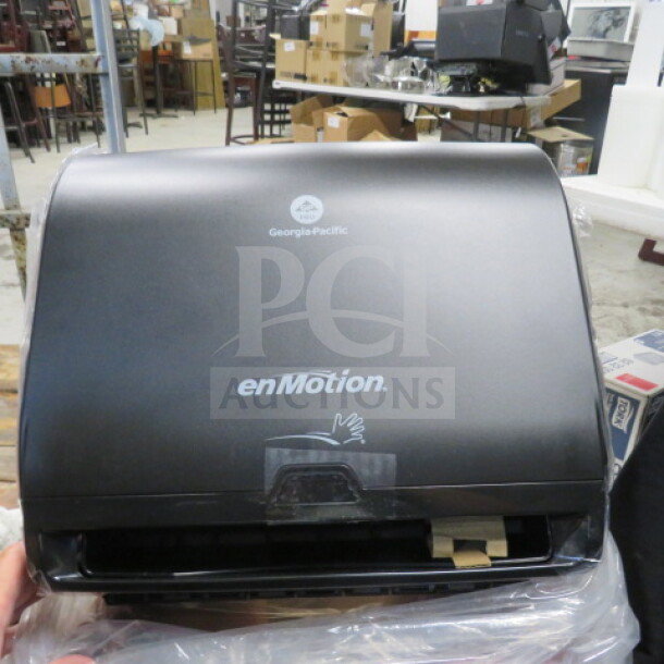 En Motion hands-free automatic paper towel dispenser, model 59488A, new condition, black, visible Georgia-Pacific logo.