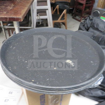 14-inch black waitress tray, used condition, surface wear visible, ideal for restaurant service. Model: 4XBID.
