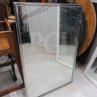 Stainless steel framed mirror, 24x36 inches, minimalist design, excellent condition, reflective surface, durable frame.